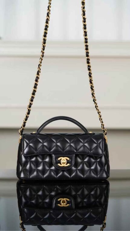 Chanel 25P new horizontal handle flap bag in black and gold 22*6.5*11cm